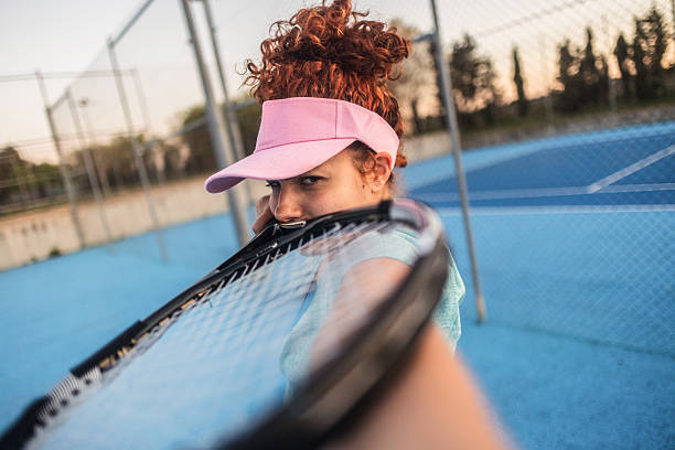 istock Tennis player holding racket on a blue court 2217781751