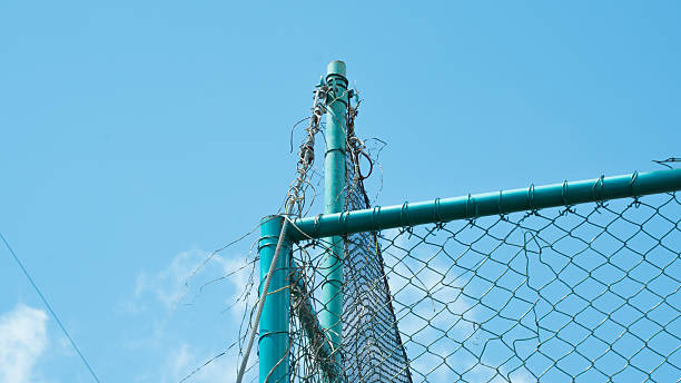 istock perspective of a fence with sky and clouds. 2217782145