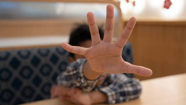 istock Child's Outstretched Hand Blocking View, Symbolizing Protection, Refusal, or Privacy in Childhood 2217782149