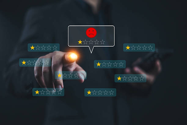 istock Customer Experience dissatisfied Concept. Unsatisfied customer, User via a smartphone reviews a 1-star rating, A man point to at icon 1 star, Negative feedback bad, bad service, Sadness emotion customer 2217782712