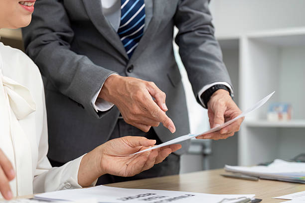 istock Teamwork in Financial Review. Business professionals analyzing financial documents together. 2217787962