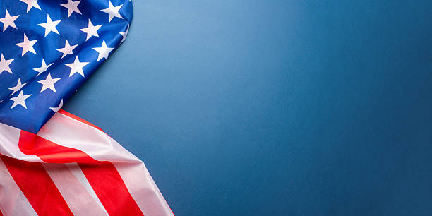 istock Blue background with American flag. 2217789969