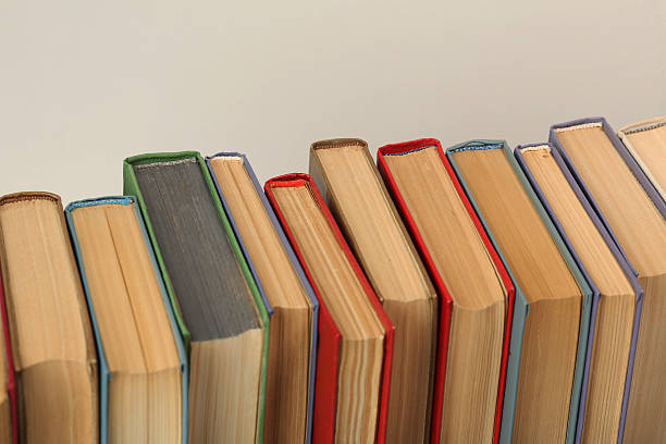 istock Open book, hardback colorful books on table. Back to school. Copy space for text. Education business concept 2217790356