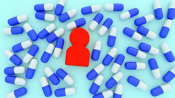 istock Human-like figurines surrounded by numerous blue and white capsules. 2217791160