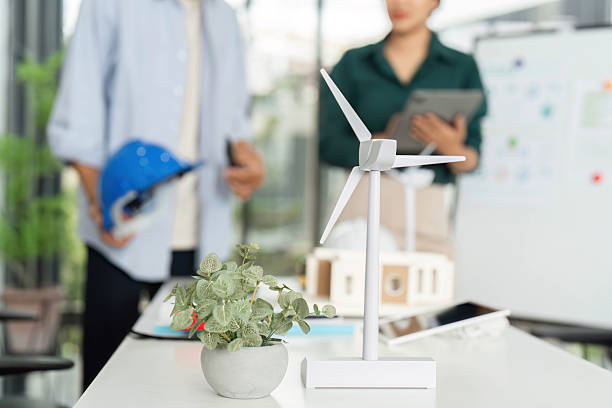 istock ESG and Sustainability. Professionals discussing renewable energy solutions in a modern office. 2217792890