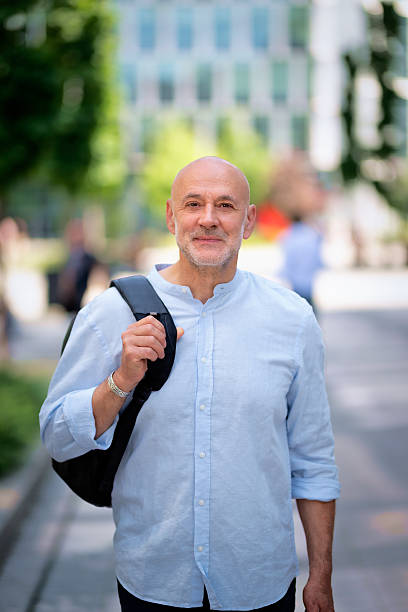 istock Man in casual clothes walking in the business district 2217799954
