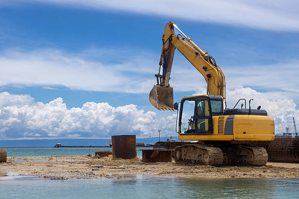 istock An excavator is building a bridge over water. A sunny day 2217800042