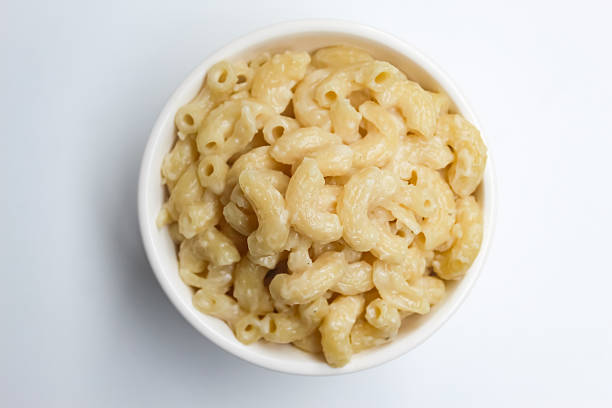 istock a bowl of macaroni and cheese pasta isolated on white background 2217800788