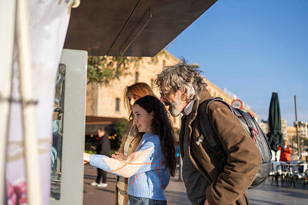 istock Family using interactive kiosk in palma de mallorca, spain 2217801860