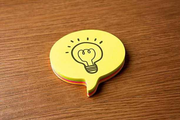istock A speech bubble and a hand-drawn icon of a glowing light bulb. 2217802080