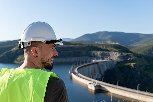 istock Engineer observing a hydroelectric dam's operation in mountainous landscape 2217802463