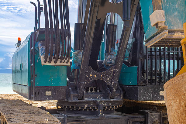 istock Excavator boom and hydraulic system, this system allows drilling large vertical and inclined holes for various purposes such as pole mounting, well drilling 2217802510