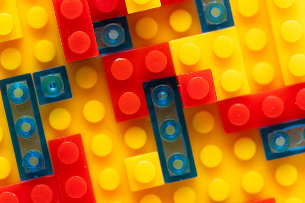 Children construction kit. Colorful plastic building blocks background. Top view. Closeup