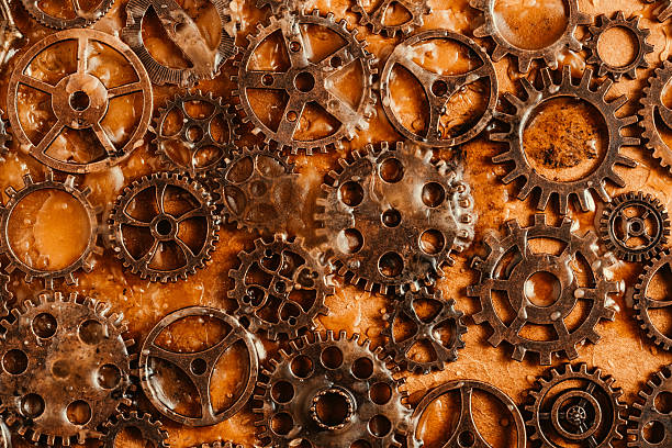 Grunge background old rusty gears filled with wax