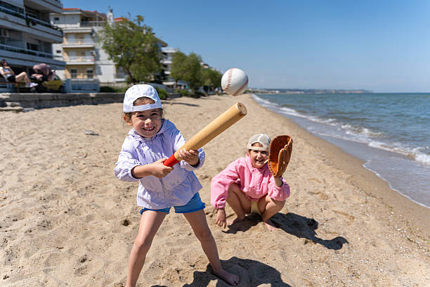 Playing beach cricket, an Australian family tradition.