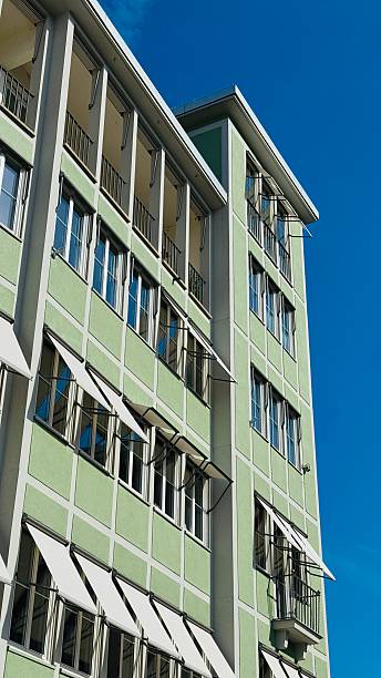 istock Green house with sun protection on blue sky 2217805074
