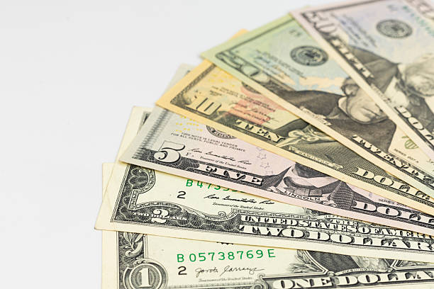 istock Set of various U.S. dollar banknotes spread out on white background 2217805152