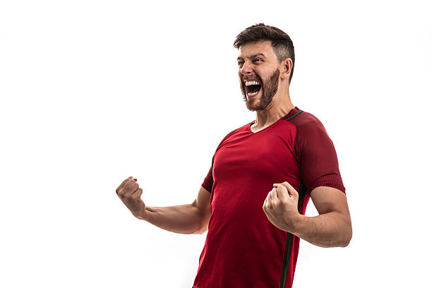 istock Excited man celebrating with clenched fists and shouting 2217805973