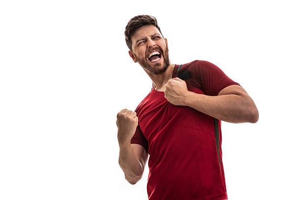 istock Excited man celebrating with clenched fists and shouting 2217806197