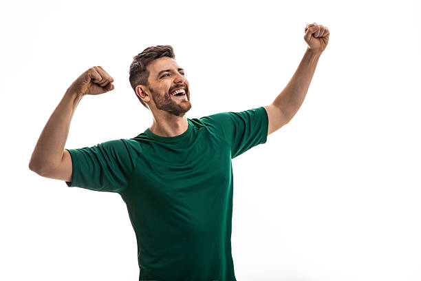 Excited man celebrating with clenched fists and shouting
