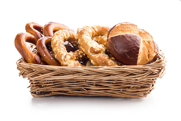 Salted bavarian pretzels and buns isolated on a white background.