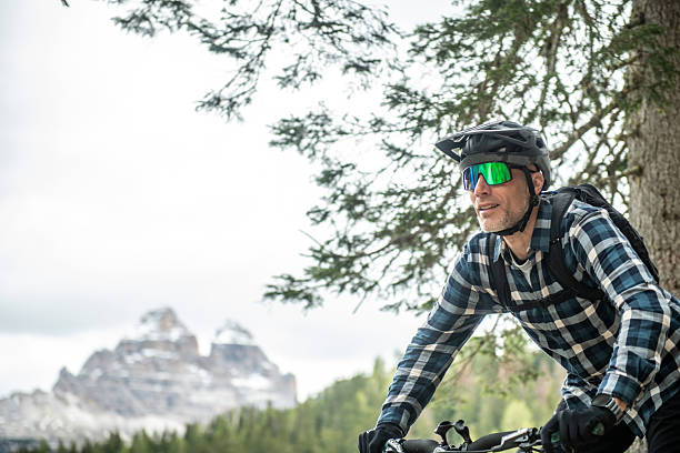 Man mountain biking the Dolomites bike trails by Lake Misurina, Tre Cime in Dolomites, Italy.