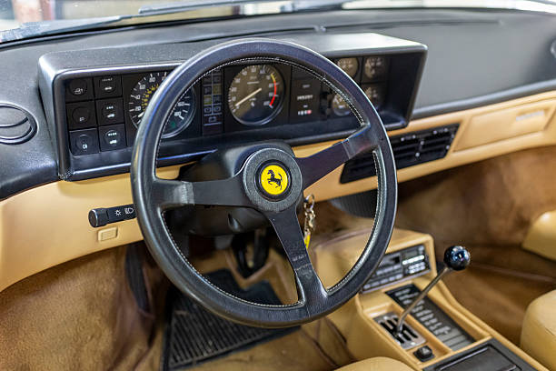 Panevezys, Lithuania - July 16, 2024: Interior shot of a classic Ferrari Mondial Cabriolet Quattrovalvole. Very nice presented beige leather interior with manual gearbox and classical three spoke steering wheel.