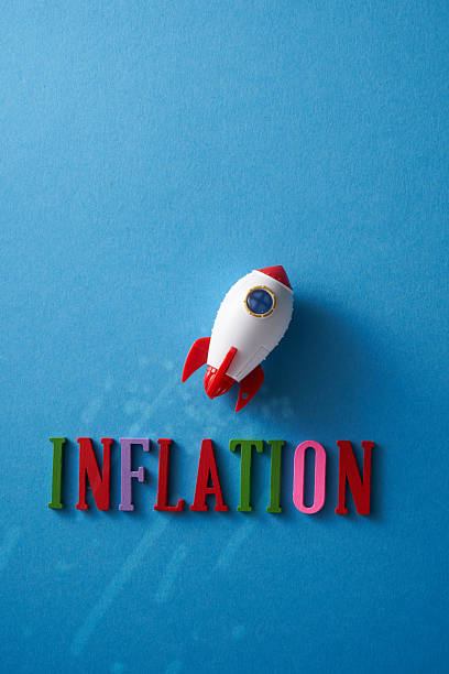 istock single word inflation and fiying rocketship against blue background 2217812002