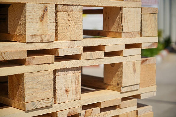 istock Wooden Pallets Stacked Outdoors Under Natural Light 2217813178
