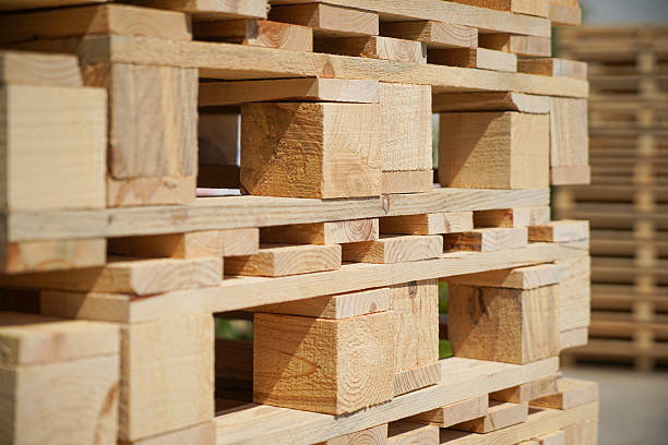 istock Wooden Pallets Stacked Outdoors Under Natural Light 2217813261