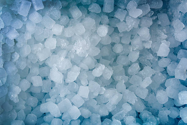istock Blue background with a pile of small ice cubes top 2217814496