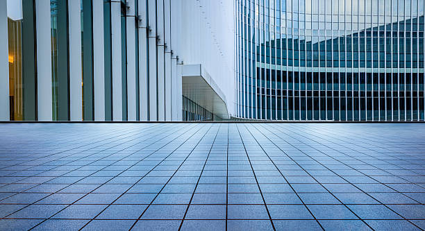 istock Empty square floors and glass wall with modern buildings scenery 2217815592