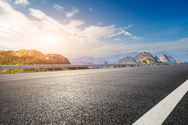 istock Empty asphalt road and mountain with beautiful sky clouds at sunrise 2217815651