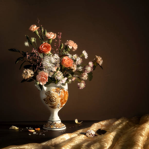summer flowers in vintage ceramic vase on dark background