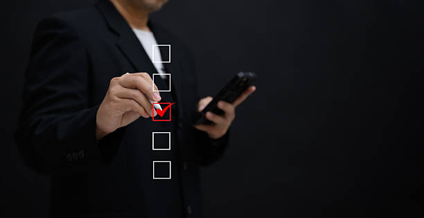 istock Performance checklist concept : businessman using stylus pen with laptop for questionnaire, evaluation, assessment online or survey exam and filling out for digital survey and checklist. 2217816056