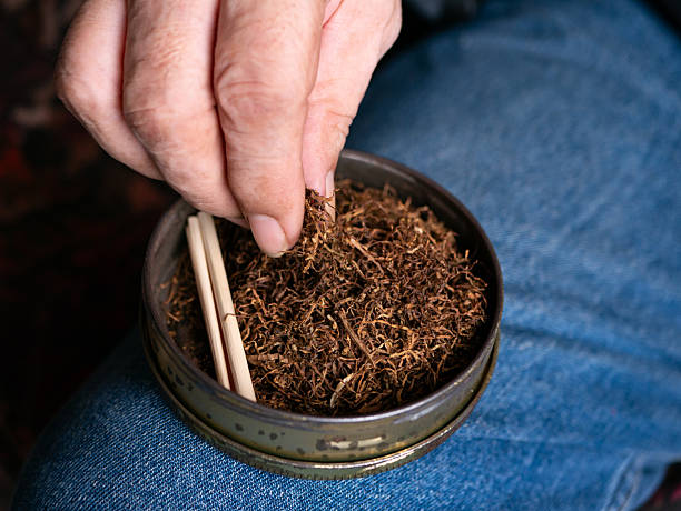 istock Preparing rolled cigarettes with dried tobacco. 2217817325