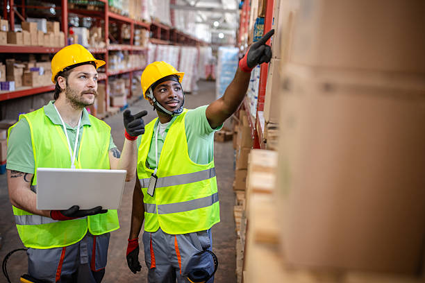 istock Warehouse workers collaborating on inventory management during a busy day in the distribution center 2217818502