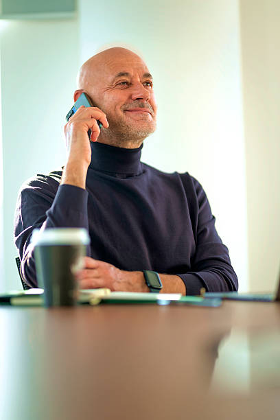 istock Man sitting at office desk and having a business call 2217826846