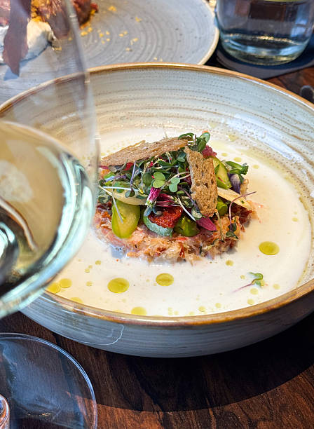 istock Snow Crab Tartare gourmet appetizer dish with asparagus, buttermilk lime herb reduction dressing served in mediterranean fine dining restaurant 2217827708
