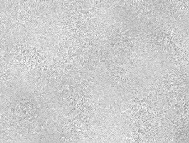 istock gray foil glass texture background. Abstract gradient bright light reflection and shiny rough texture surface. metal texture background 2217827867