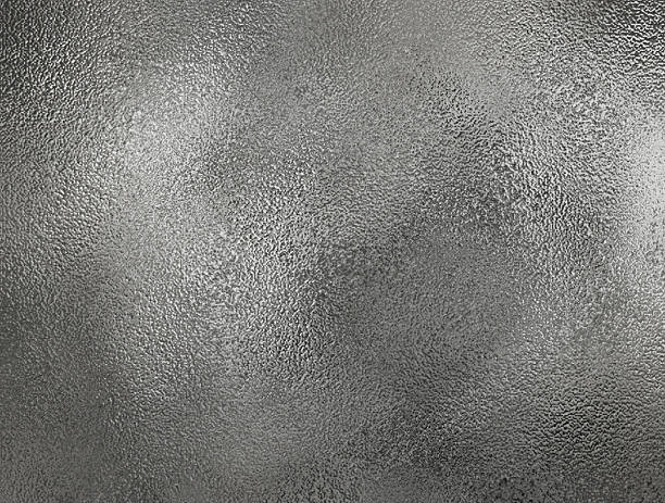 istock gray foil glass texture background. Abstract gradient bright light reflection and shiny rough texture surface. metal texture background 2217828489