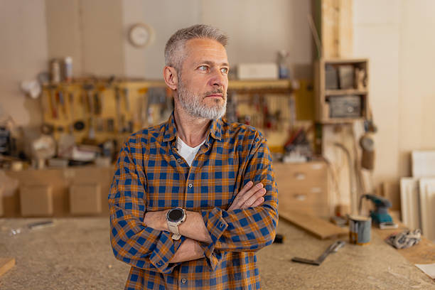 istock Craftsman Thinking with Arms Crossed in Workshop 2217828591