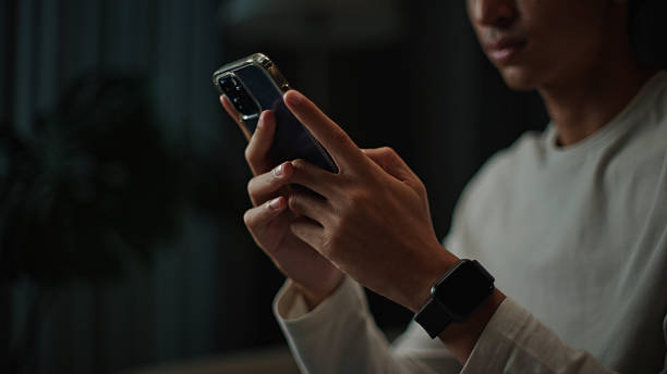 istock Controlling home lights with smartphone. 2217830123