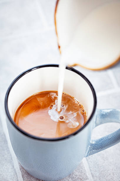 istock Hot black americano coffee and pouring milk 2217830754