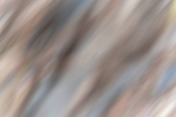 Diagonal Blur in Warm Tones. The blur runs diagonally and creates a soft, flowing movement. Gradients in beige and gray dominate the image.