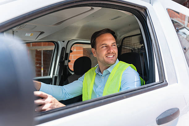 istock Engineer in vehicle inspecting building site wearing high visibility vest and smiling 2217839432