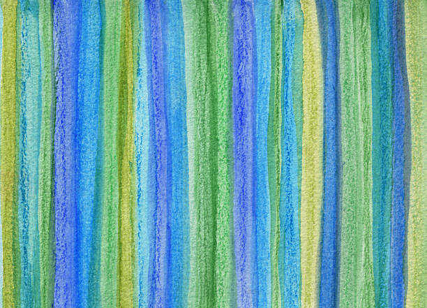 Hand painted watercolor background on paper with prominent shades of green and blue