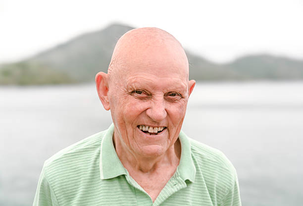 Portrait of a bald man smiling