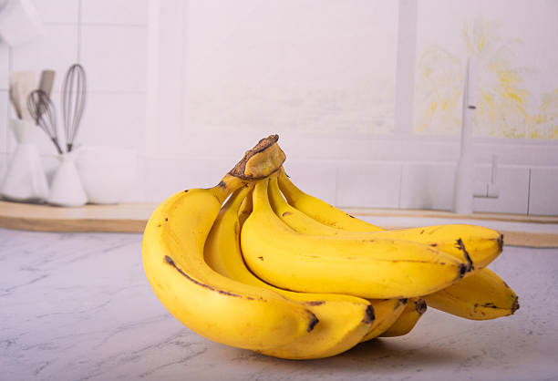 istock Bananas, bunch of ripe bananas in a bright environment, selective focus. 2217843038