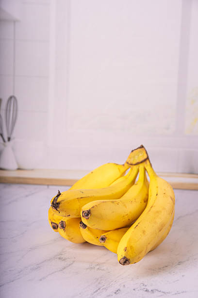 istock Bananas, bunch of ripe bananas in a bright environment, selective focus. 2217843049